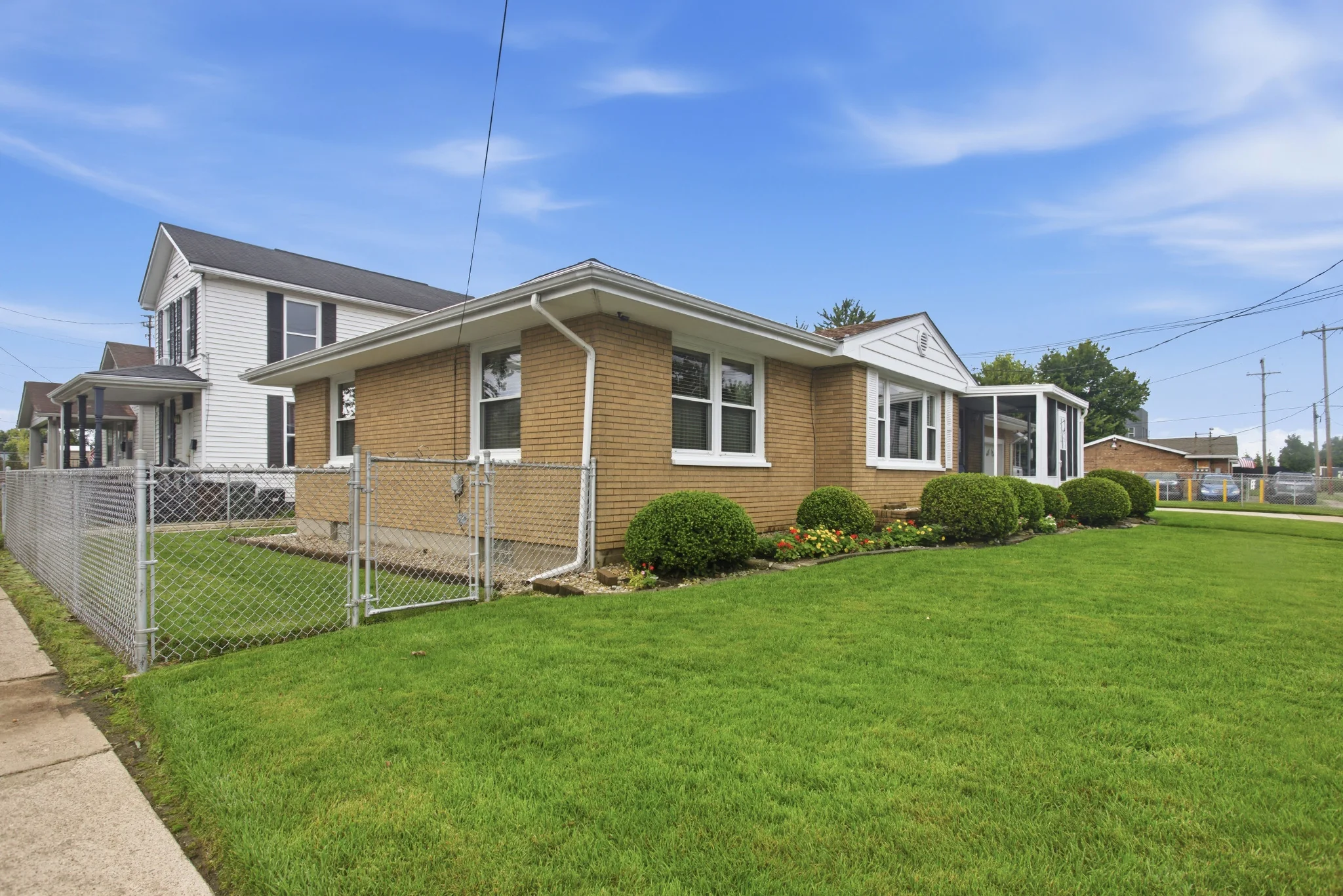 Side exterior and fenced yard at 1127 Lincoln Ave. in Hamilton, Ohio