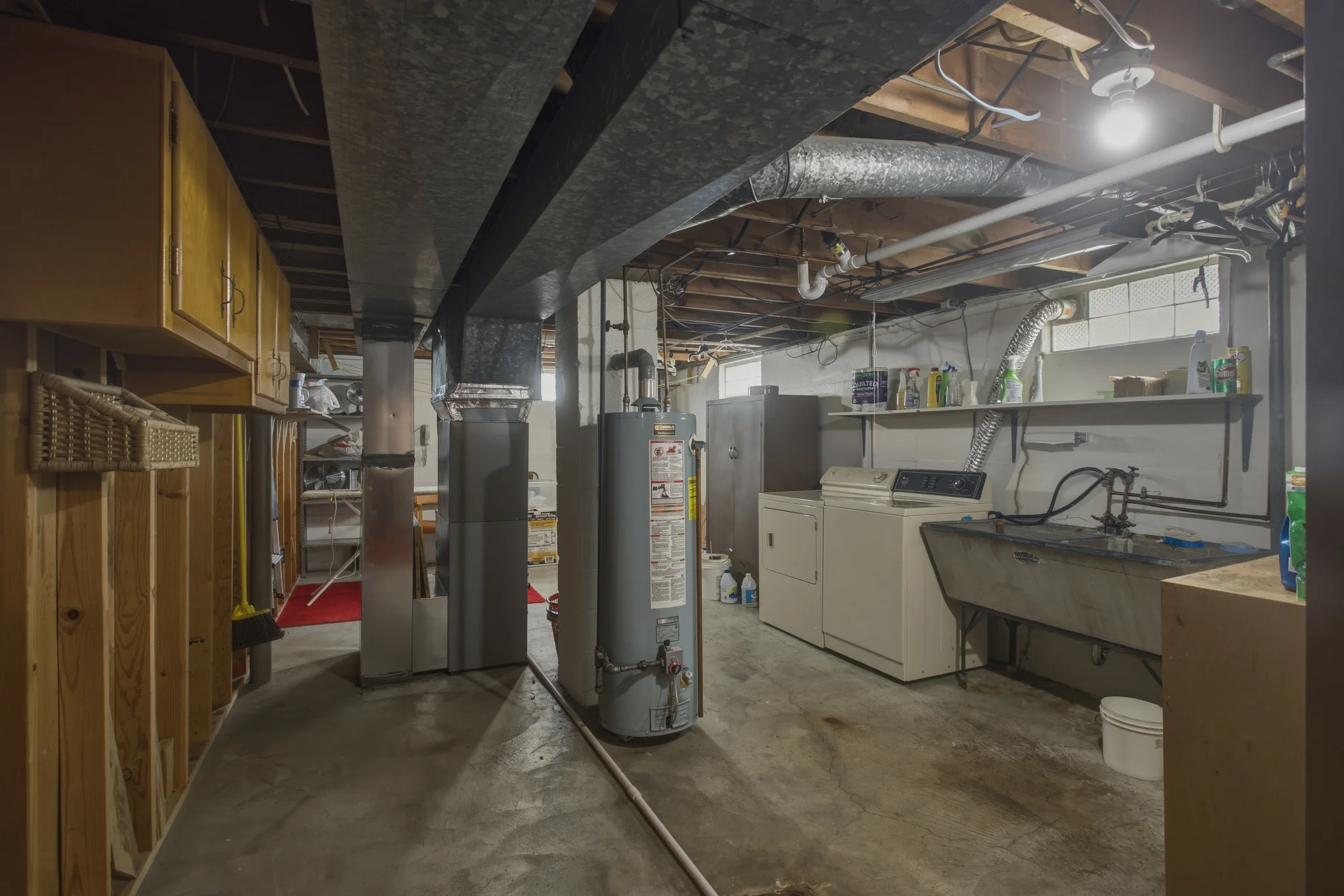 Unfinished basement laundry and utility area
